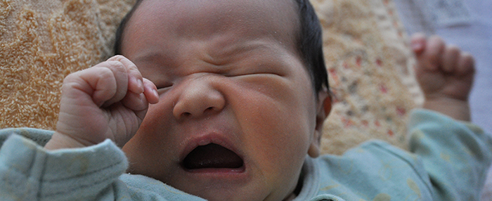 Baby yawns and stretches
