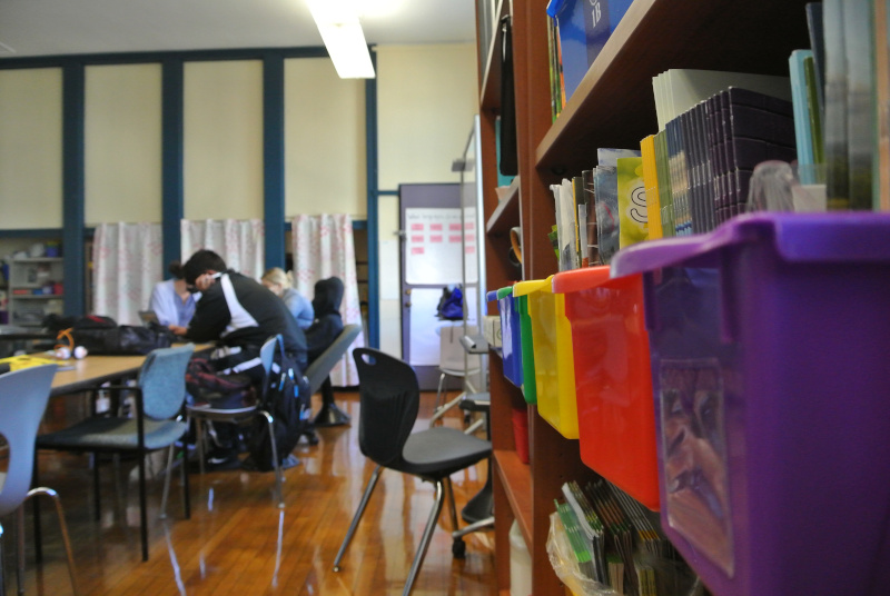Classroom with chairs, desks, and storage areas