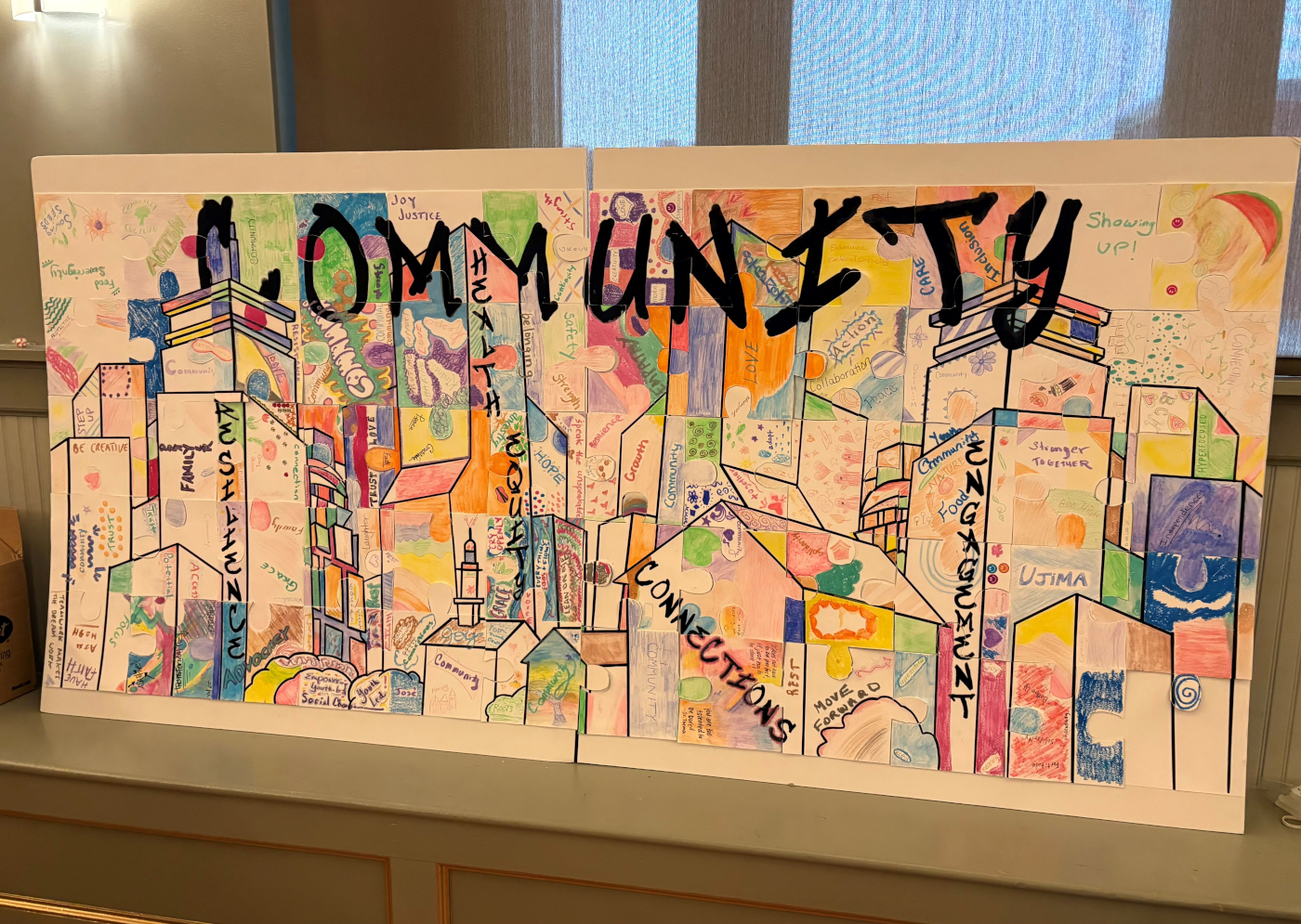 Artistic puzzle, with the word "COMMUNITY" at the top
