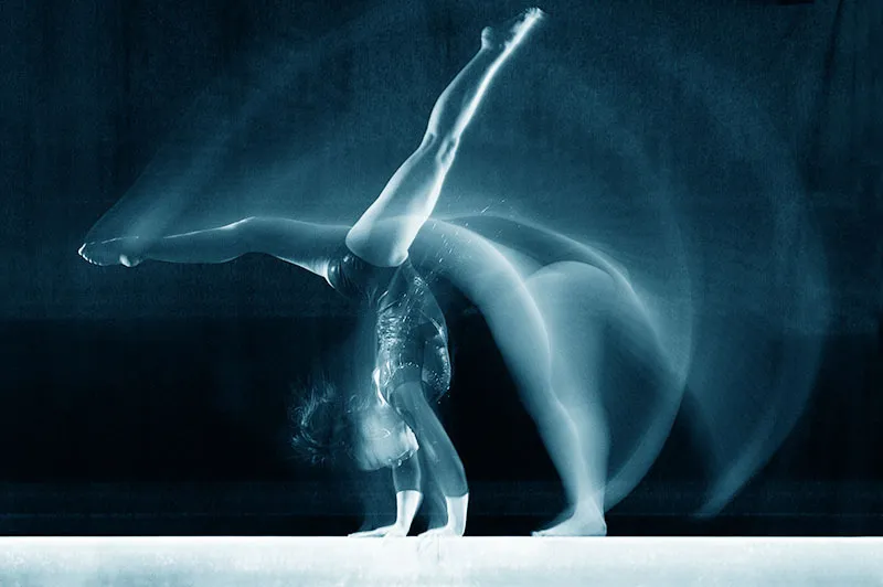 Illustration of gymnast making a move on balance beam