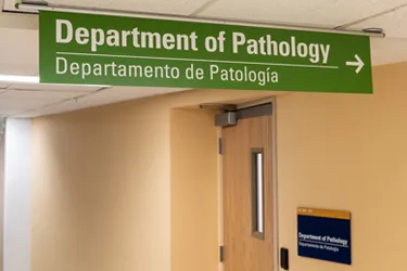 Sign for Department of Pathology with a right arrow for directions