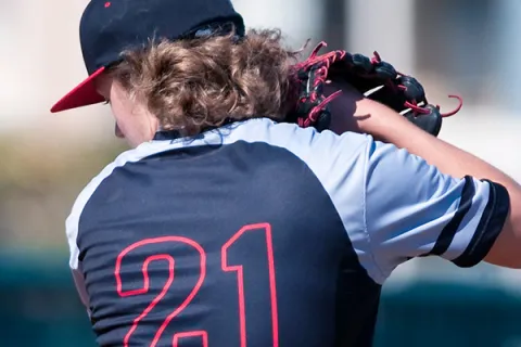 Baseball pitcher in middle of windup